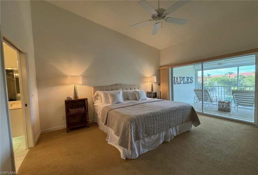 Bedroom featuring high vaulted ceiling, carpet, ceiling fan, and access to exterior