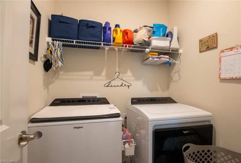Laundry room with washing machine and dryer and washer hookup