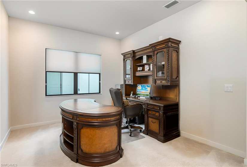 Office featuring built in desk - This picture was digitally altered