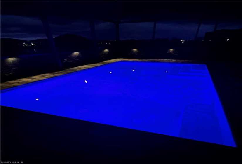 View of pool at twilight