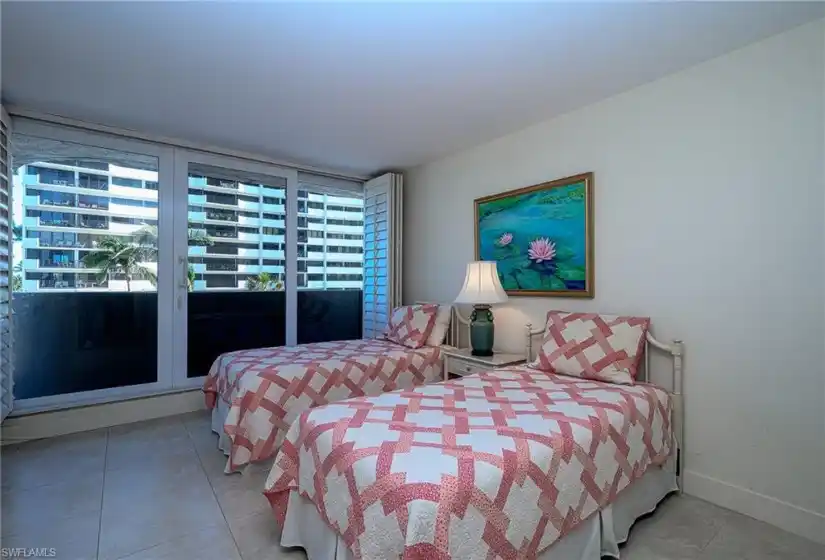 Guest bedroom with view of the Gulf and lanai access
