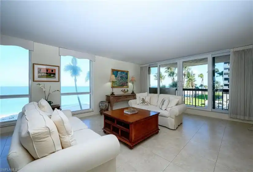 Spacious Living room with unobstructed direct west, north and south views of the Gulf