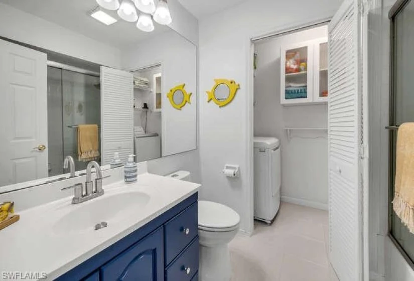 Main bath and laundry room (full-size washer and dryer!) opens into the hallway.
