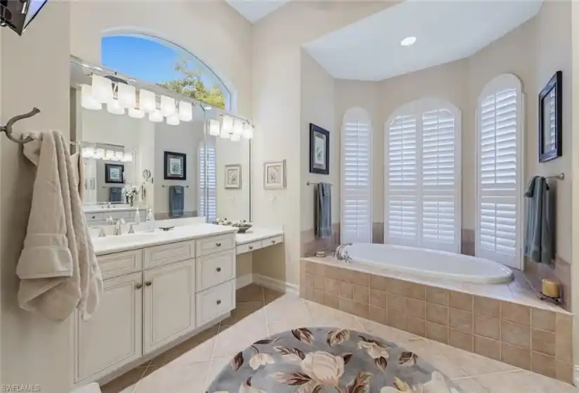 Lovely transom window letting additional sunlight as you relax in your soaking tub!