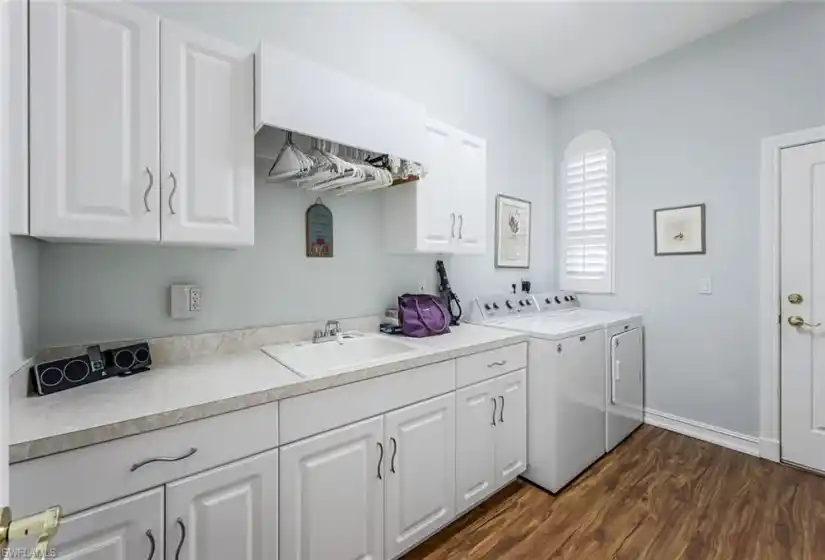 Large utility room with sink, plantation shutter window and great counter folding space!