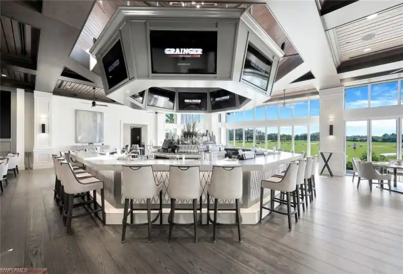 The Golfside Grill is a 9,000 square foot indoor-outdoor casual dining venue that features a folding glass door system for all-weather enjoyment of expansive sunset and golf course views.