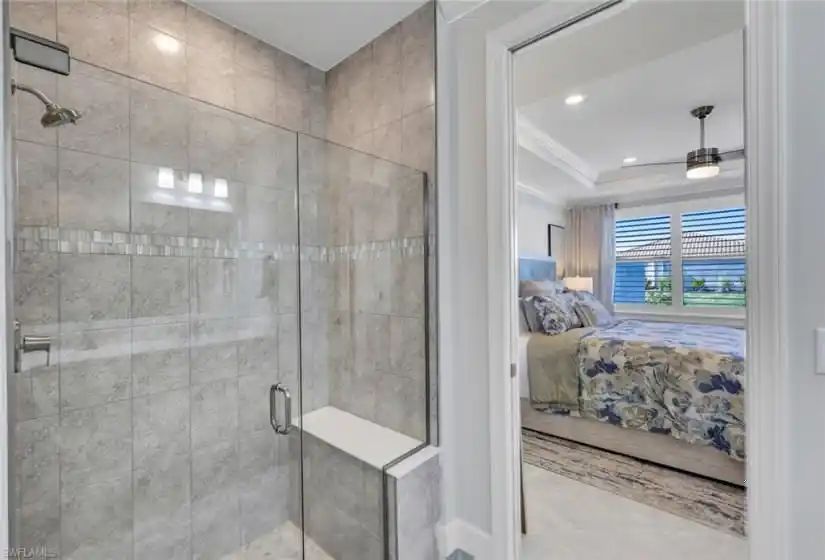 The walk-in shower was upgraded with a frameless glass door and tile to the ceiling.