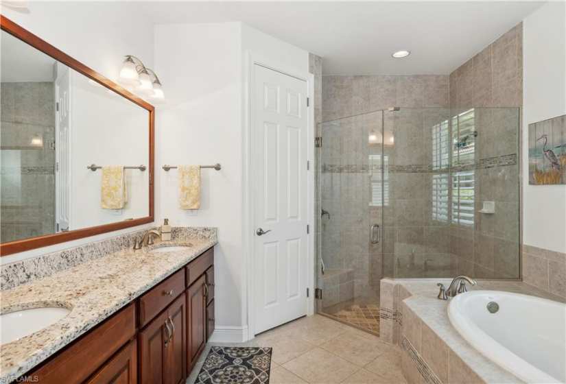 Dual sinks with separate shower and soaking tub