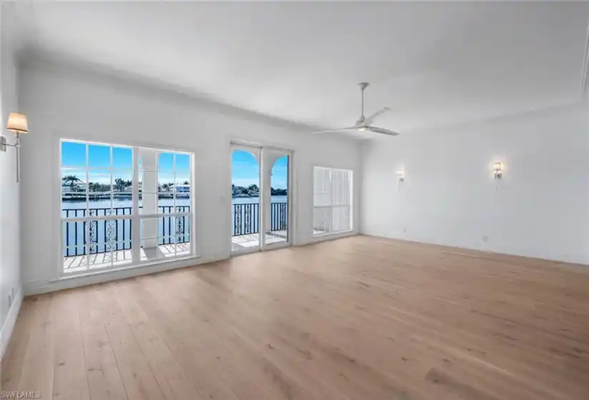 Great Room with hardwood floors and eastern view of Venetian Bay.
