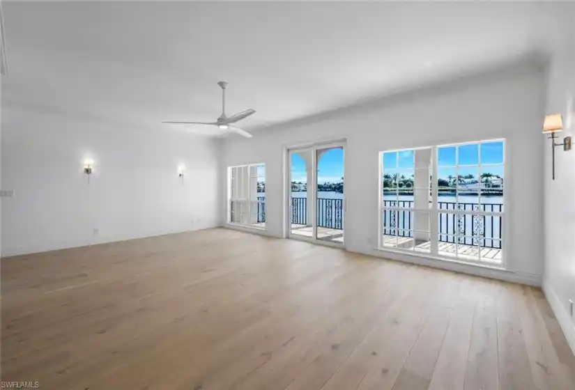 Great Room with hardwood floors and eastern view of Venetian Bay.