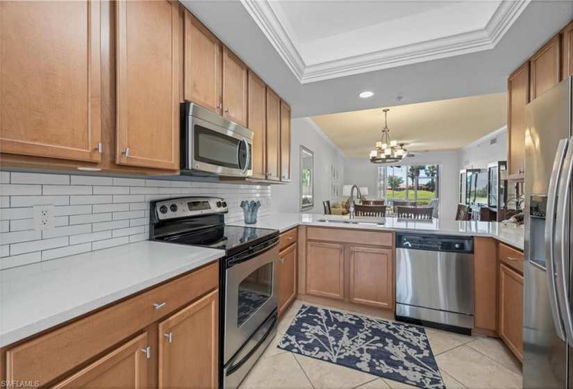 Great kitchen featuring new granite counter tops and backsplash