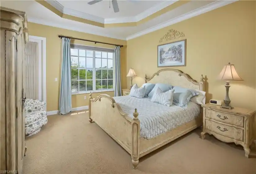 The overszed primary bedroom, with lanai access, will serve as your retreat after a fun day on the golf course, at the beach, or on the tennis courts!