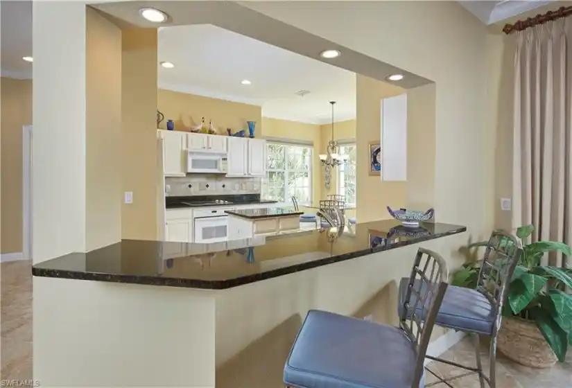 You will love this kitchen, with a breakfast bar AND a nook overlooking the lake.