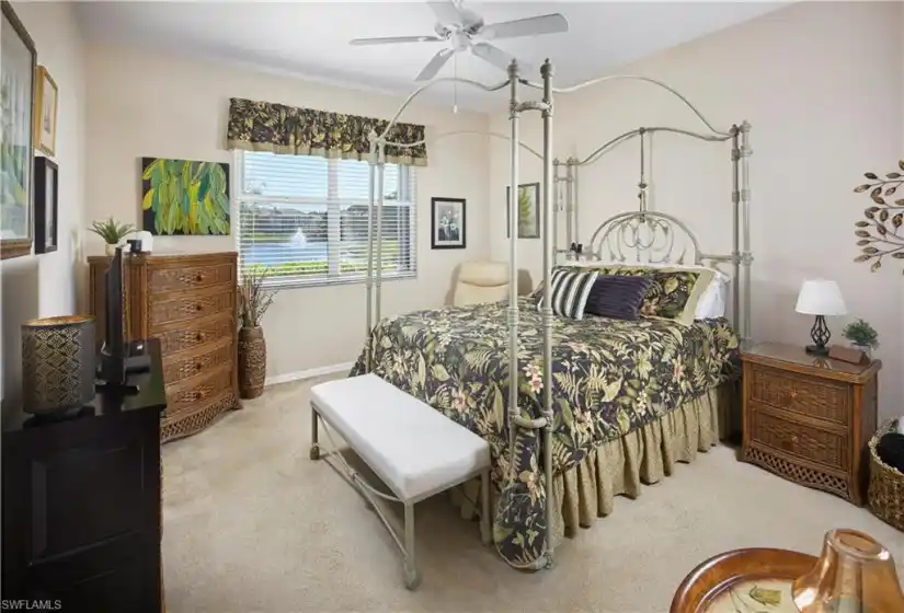 Large primary bedroom suite with lake view.