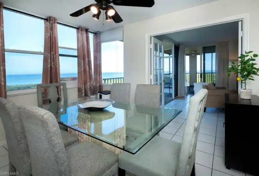 Dining room with amazing views of the Gulf, blue skies and the lush green mangroves below.