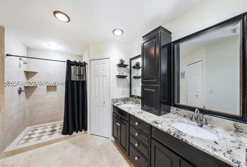 Master bath with 2 walk-in closets and step-in shower